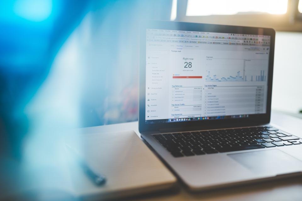 Analytics and research charts open on a laptop screen